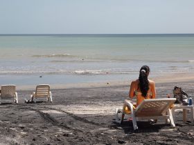 Coronado Beach, Panama with woman in bathing suit – Best Places In The World To Retire – International Living